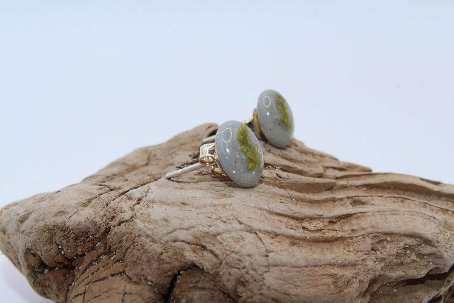 Shimmering Grey Stud Earrings With Pressed Green Leaf