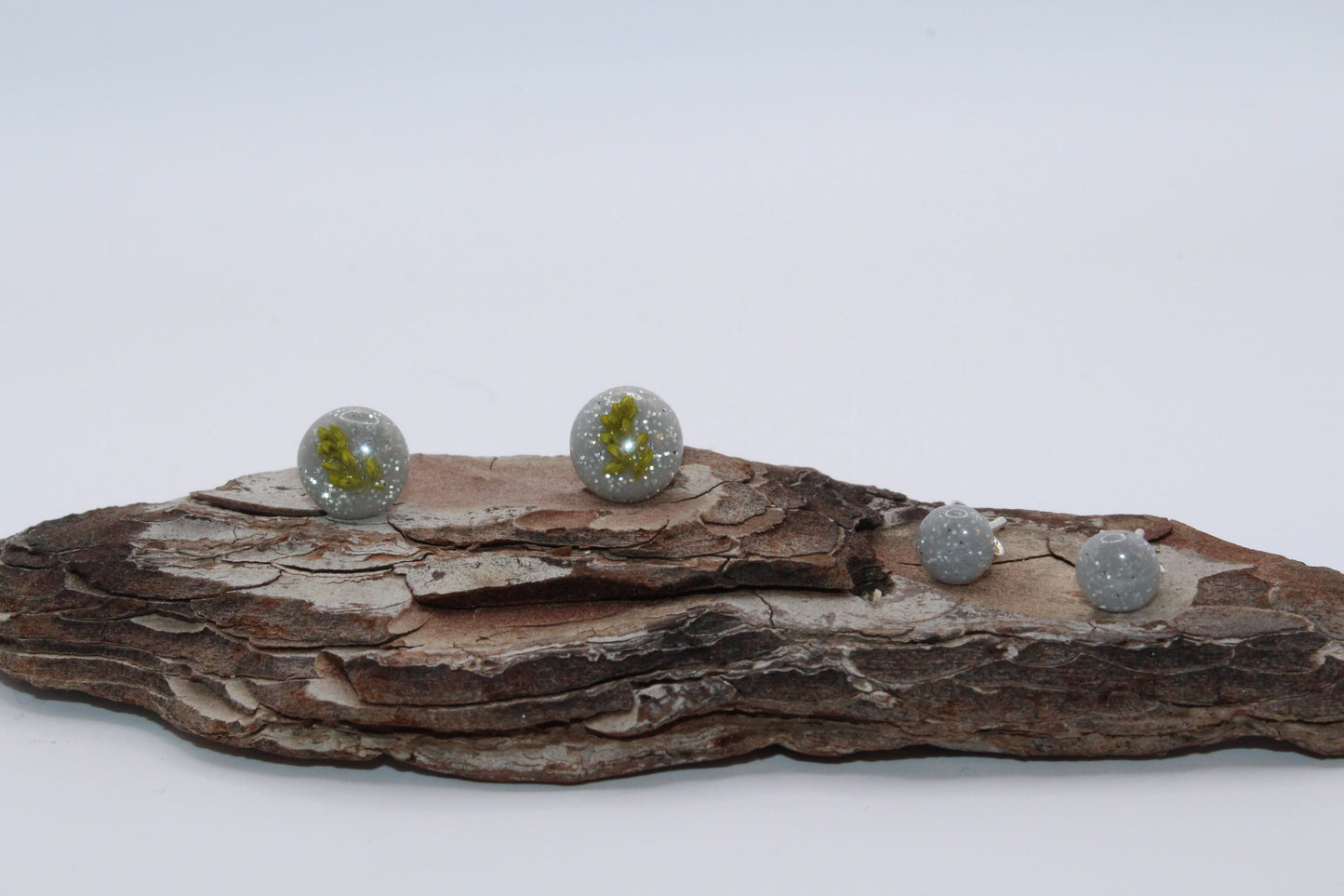 Shimmering Grey Stud Earrings With Pressed Green Leaf